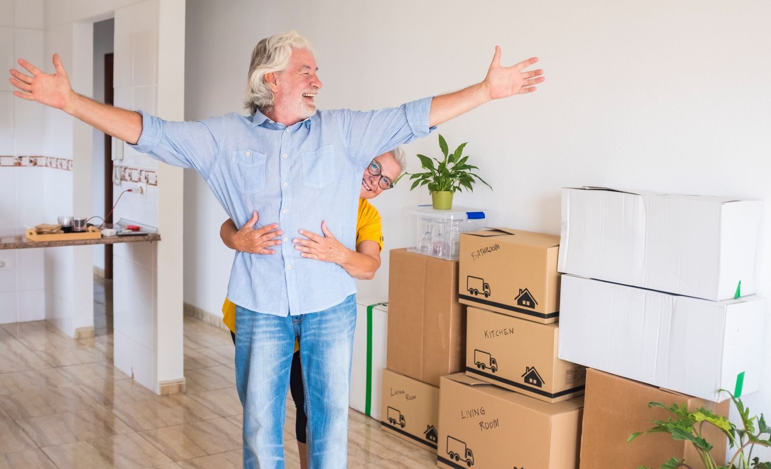 senior couple grandparents packing fragile items