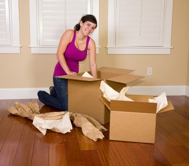 Woman with packing supplies- start planning early